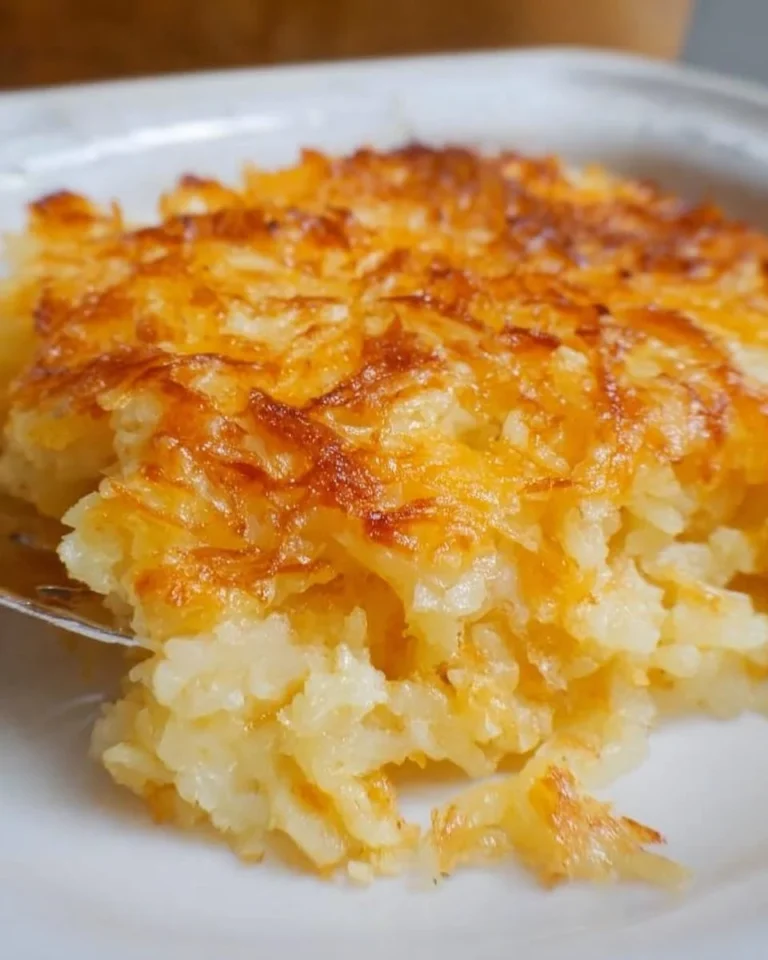 Delicious Hashbrown Casserole topped with cheese and herbs, perfect for any meal.