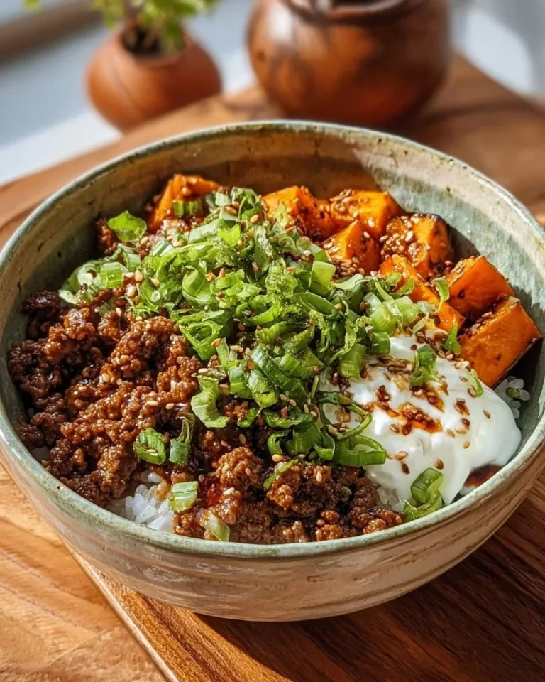Ground Beef Hot Honey Bowl topped with herbs and served in a bowl